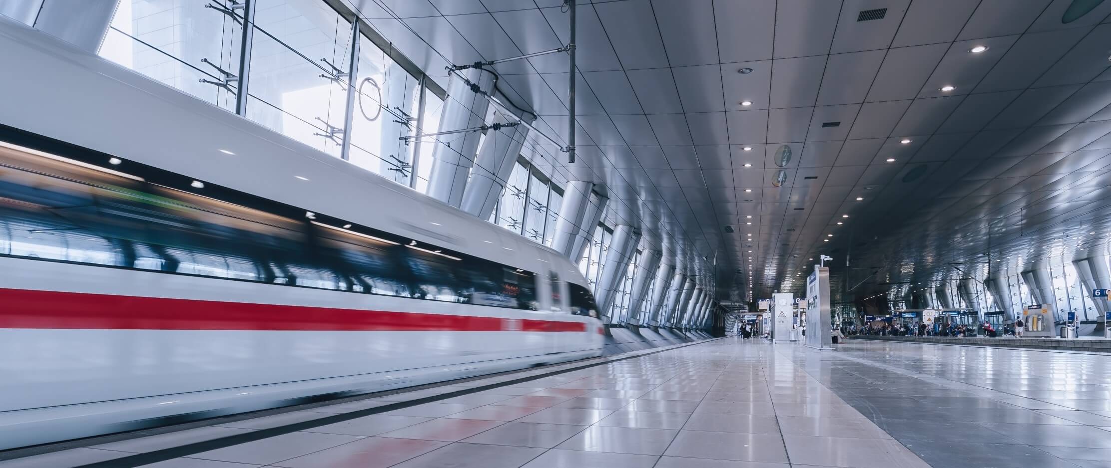 Fast moving train entering frankfurt am main airport station.