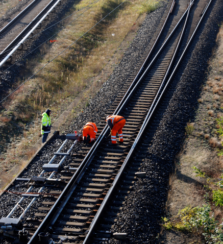 Rail workers working on the rail.